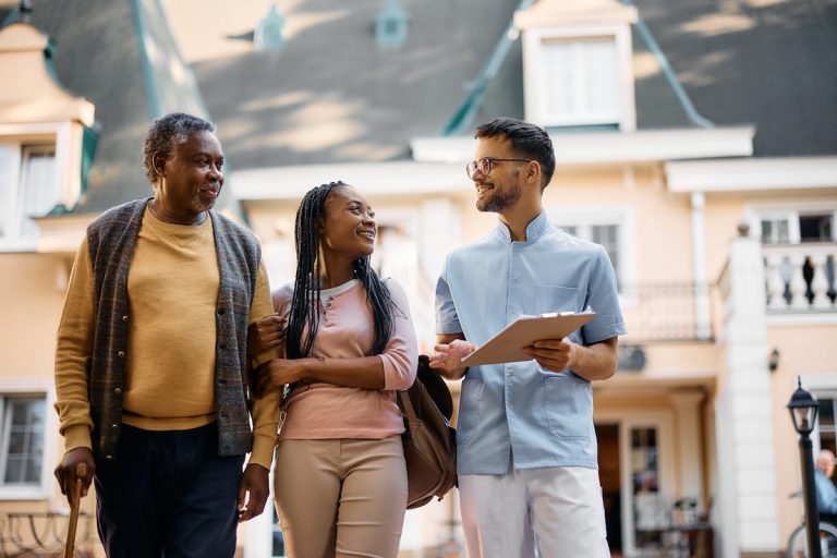 Questions to Ask a Boca Raton Senior Living Community Senior Man and Daughter Asking Questions While Touring Boca Raton Senior Living Community_Sunscape™ Boca Raton