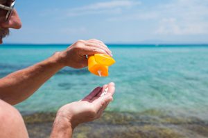 5 Summer Safety Tips to Keep You Having Fun All Season Long Senior Man Using Sunscreen_Summer Safety_Sunscape™ Boca Raton