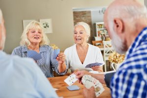 Group of Happy Seniors Playing Cards_Memory Care Boca Raton