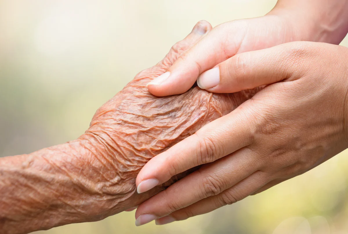 Close Up of Senior and Caregiver Hands_Memory Care in Boca Raton