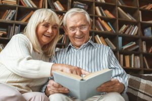 Senior Couple Reading Together_Retirement Community in Boca Raton