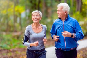 Smiling Senior Couple Jogging_Boca Raton Senior Living