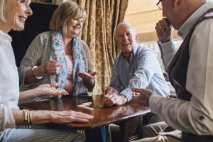 Group of Seniors Playing Dominos_Memory Care in Boca Raton