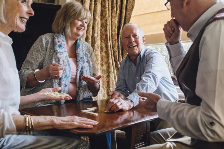 Group of Seniors Playing Dominos_Memory Care in Boca Raton