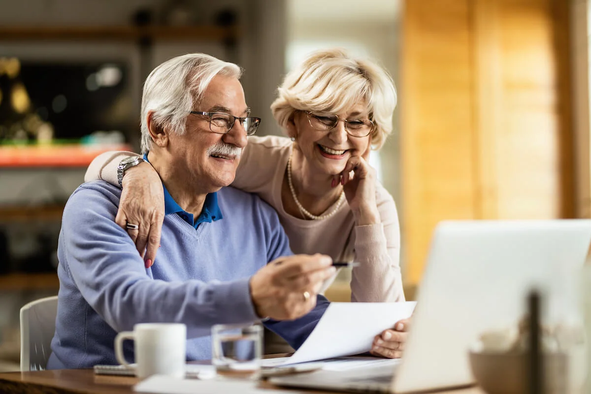 Seniors Happily Going Through Their Finances