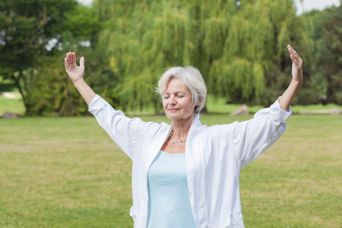 Older woman relaxing outdoors.