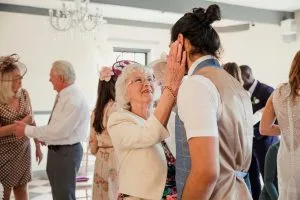 Adult son dancing with his mom on Mothers Day