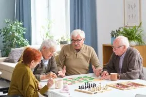 Seniors in a community setting playing board games