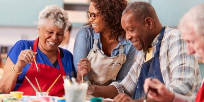Group of seniors with dementia at an arts and crafts class