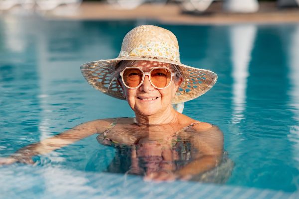 Older adult in senior living community pool Older adult in senior living community pool